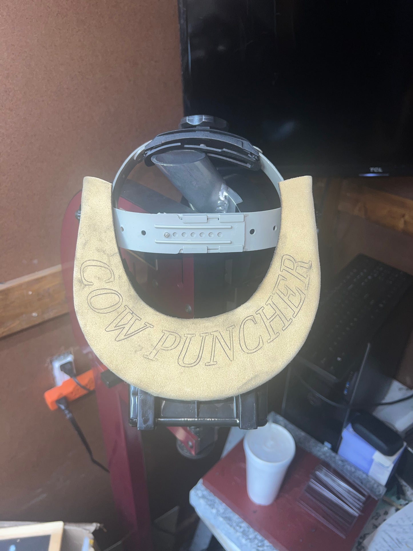 Cow puncher welding hood.