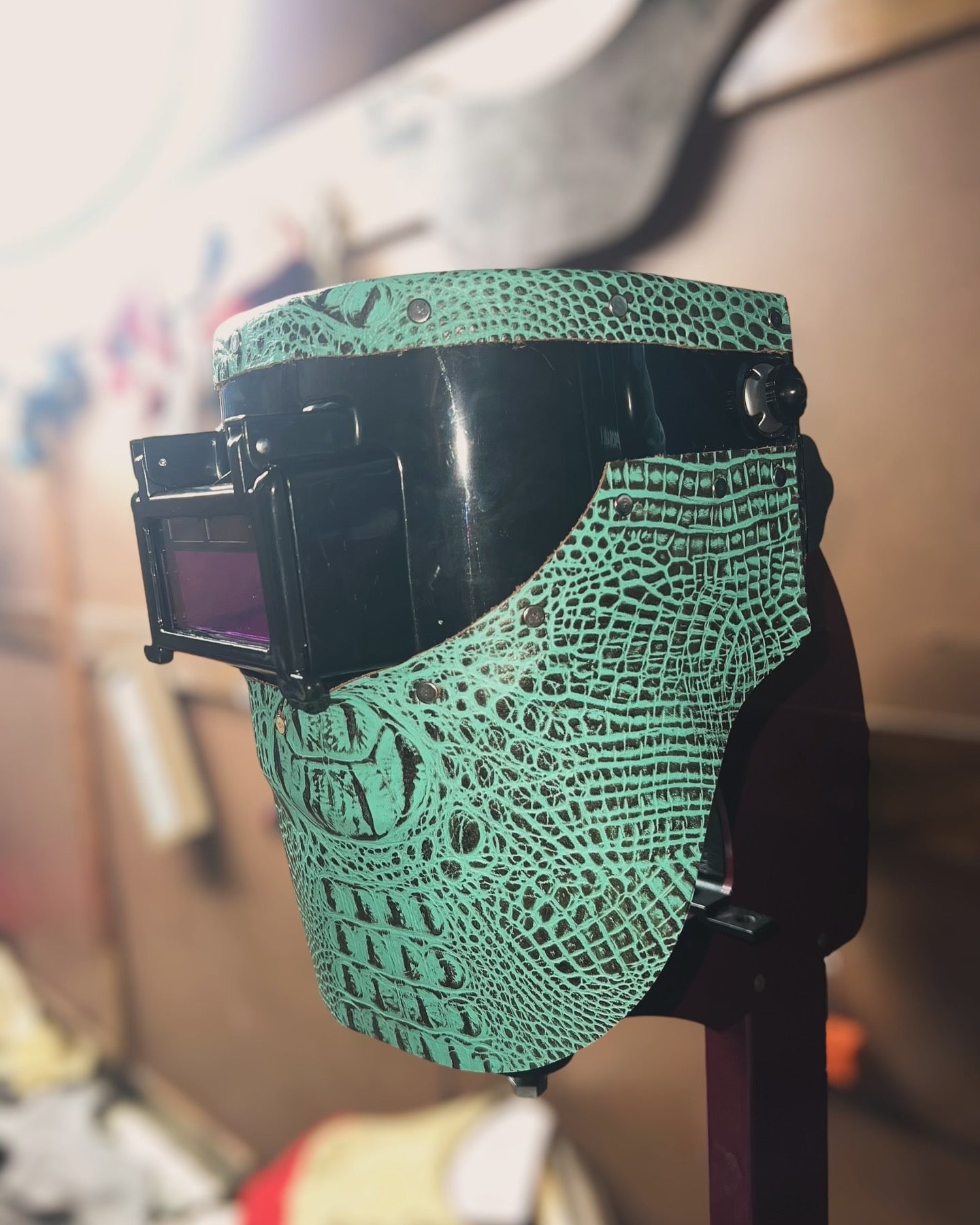 Teal alligator custom welding hood.