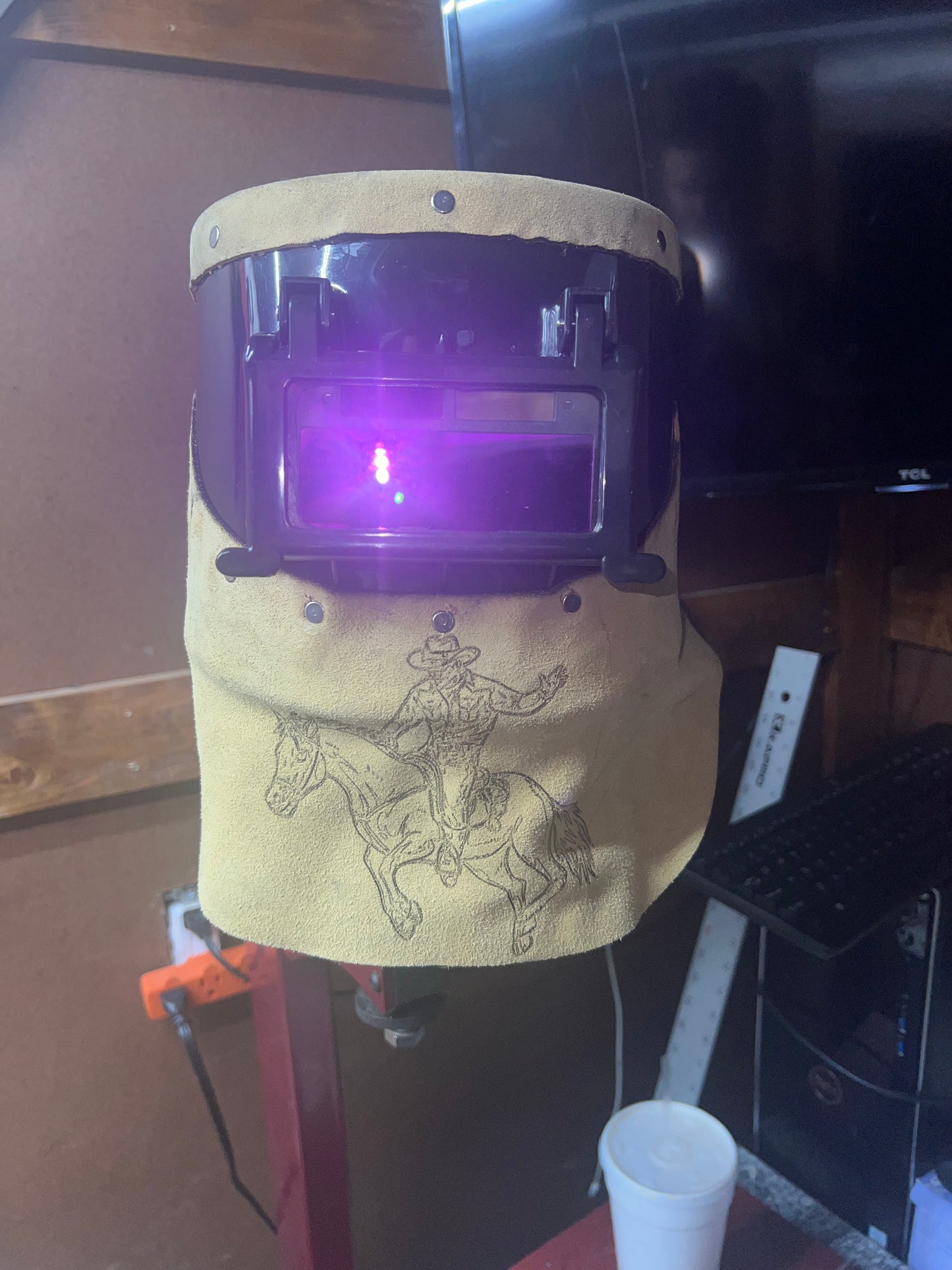 Cow puncher welding hood.